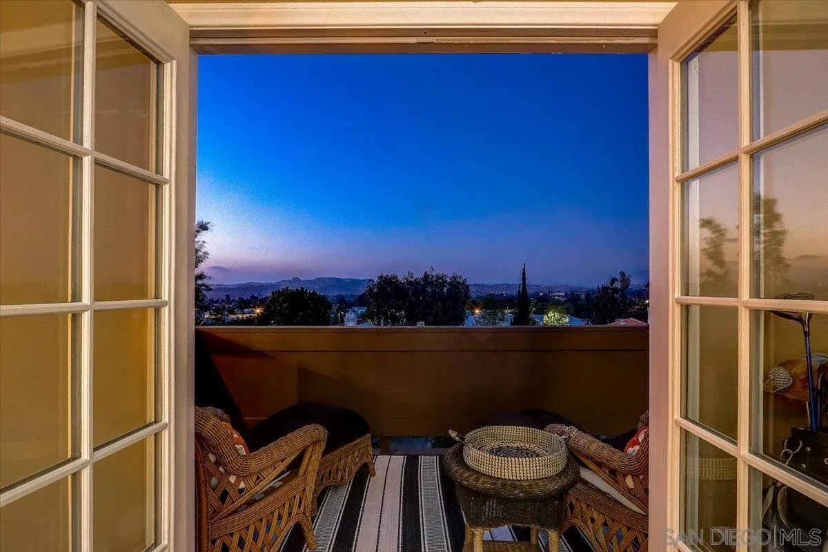 5080 Frazee Road Oceanside, CA 92057 - Photo 2 of 44 a view of a balcony with chair and wooden floor