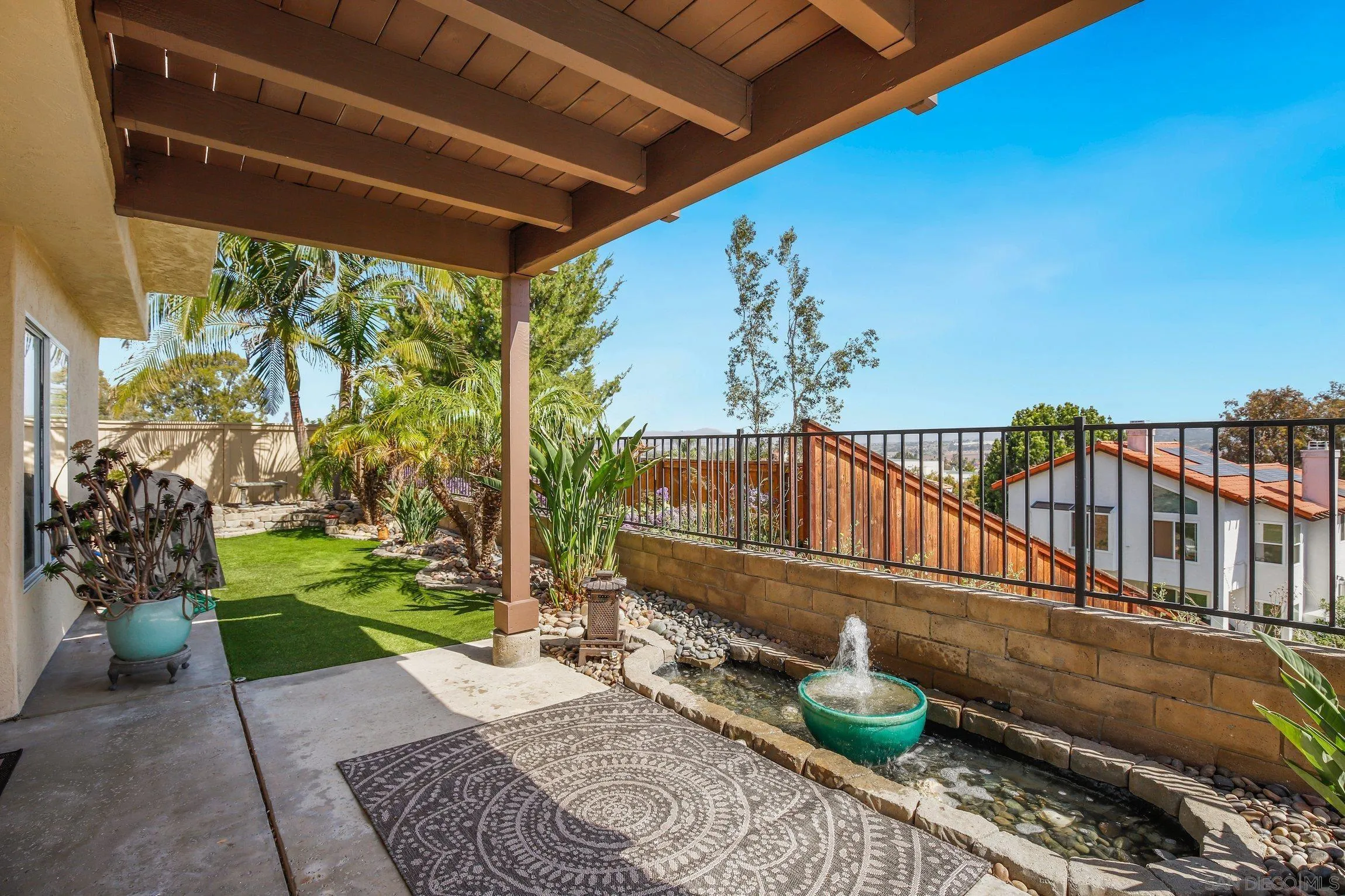 5080 Frazee Road Oceanside, CA 92057 - Photo 28 of 44 a view of a house with backyard and sitting area