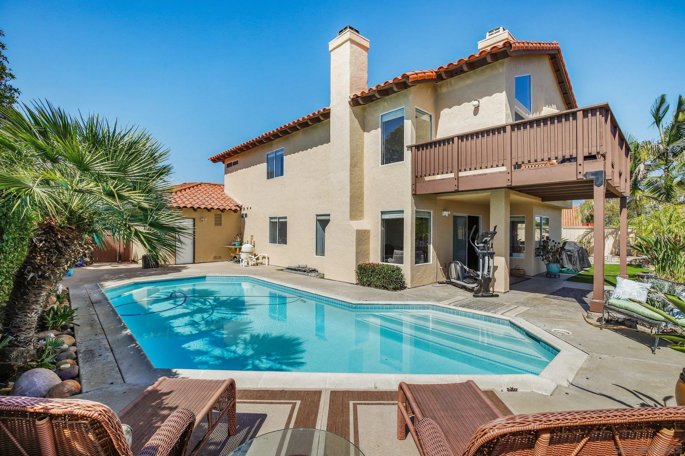 5080 Frazee Road Oceanside, CA 92057 - Photo 32 of 44 a view of a house with backyard porch and sitting area