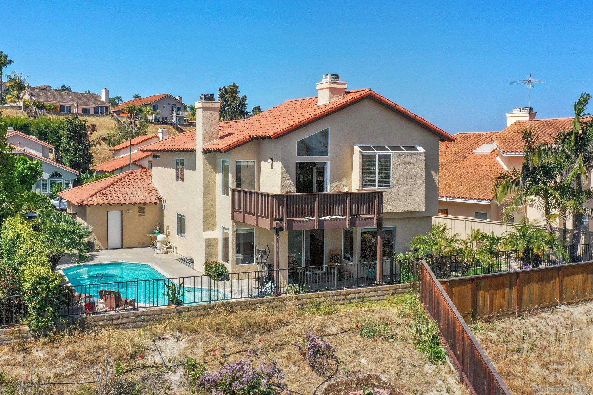 5080 Frazee Road Oceanside, CA 92057 - Photo 34 of 44 a view of house with a yard and balcony