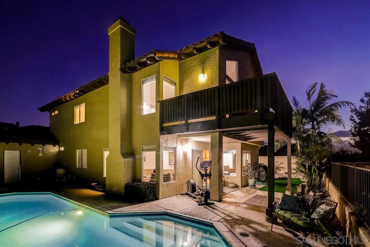 5080 Frazee Road Oceanside, CA 92057 - Photo 4 of 44 a front view of a house with a yard