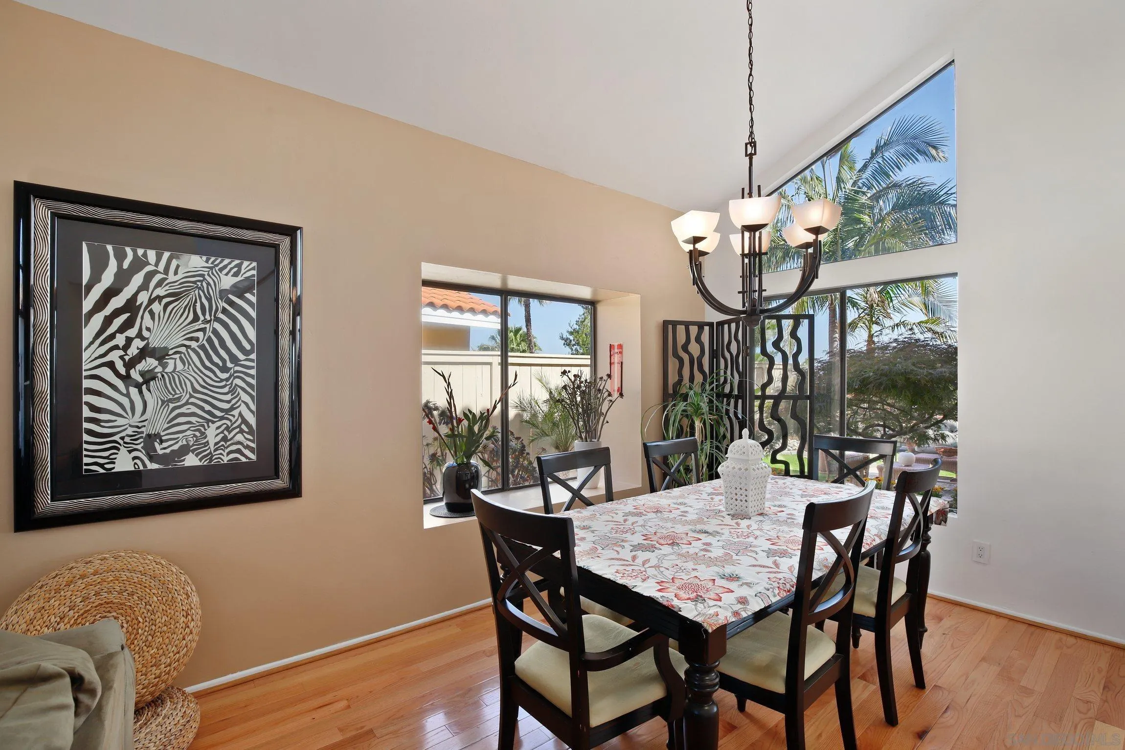 5080 Frazee Road Oceanside, CA 92057 - Photo 8 of 44 a view of a dining room with furniture wooden floor and chandelier