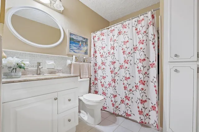 a bathroom with a toilet and a sink