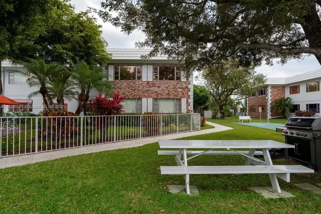 a view of a house with a yard porch and sitting area