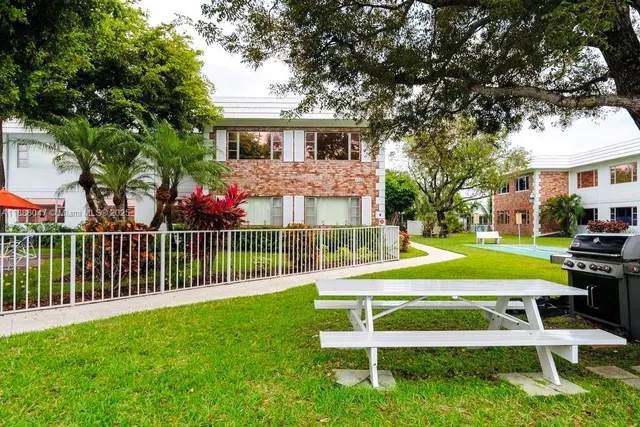 a view of a house with a yard porch and sitting area