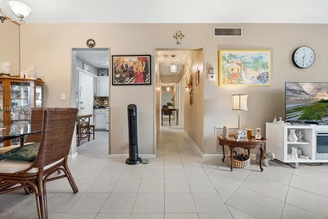 a view of a livingroom with furniture and a flat screen tv