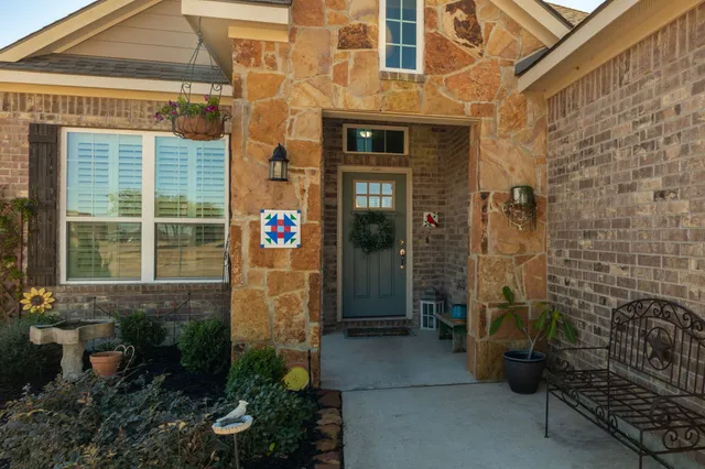 a view of a brick house with a large windows