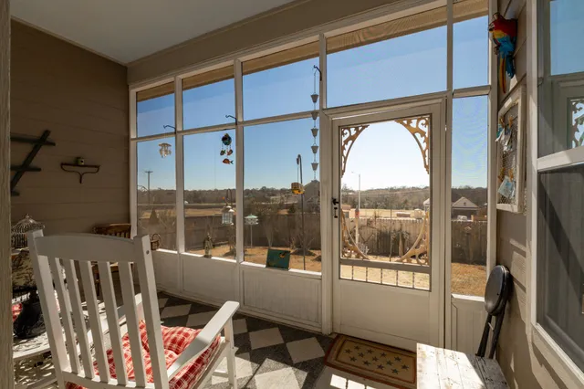 a view of living room with a large window