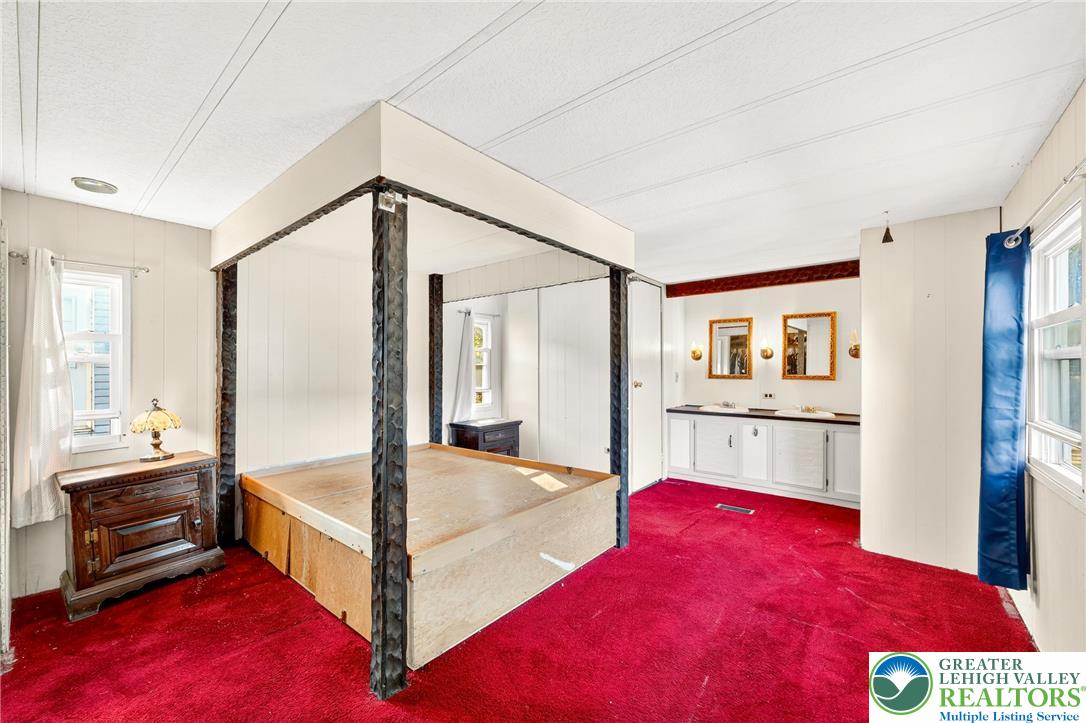 8220 Airport Road, Unit 4 Coatesville, PA 19320 - Photo 13 of 28 a bedroom with a bed and a view of kitchen