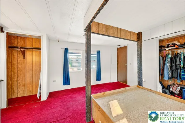 a bed room with a bed and a window