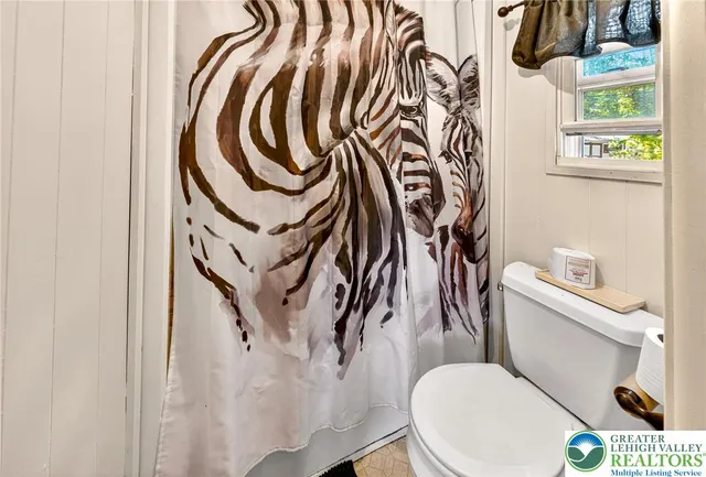 a bathroom with a toilet and a sink