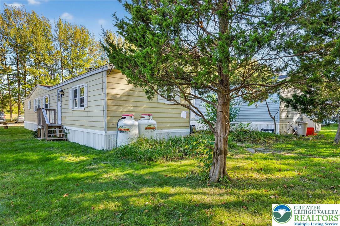 8220 Airport Road, Unit 4 Coatesville, PA 19320 - Photo 25 of 28 a view of a house with a yard
