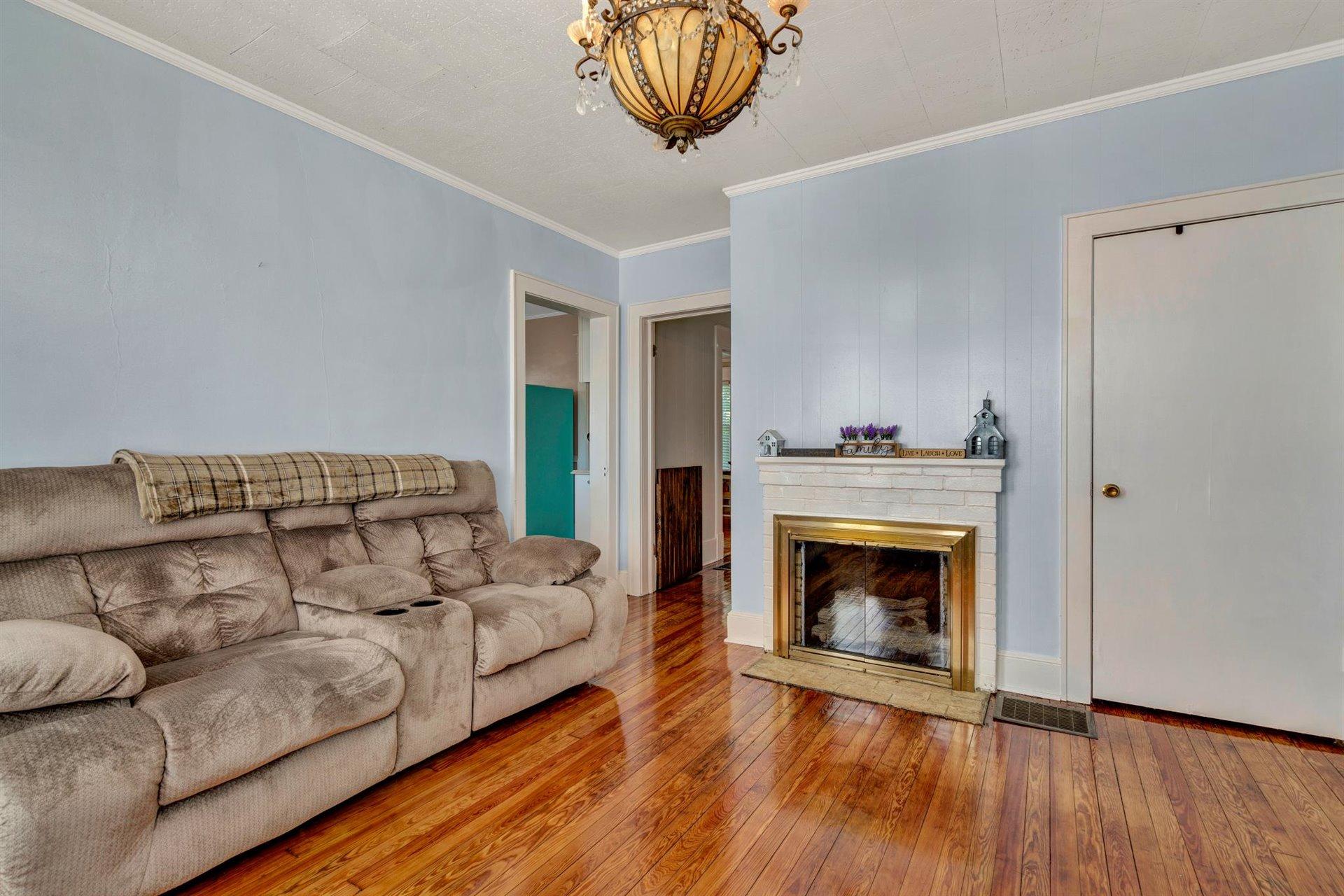 3840 Cove Road Roanoke, VA 24017 - Photo 11 of 47 a living room with furniture and a fireplace
