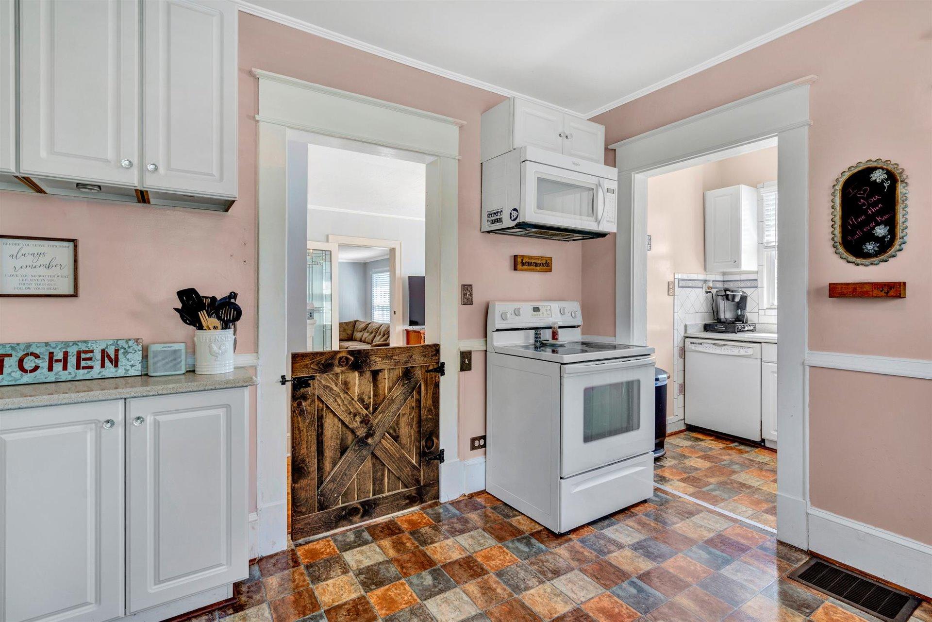 3840 Cove Road Roanoke, VA 24017 - Photo 13 of 47 a kitchen with white cabinets and white appliances