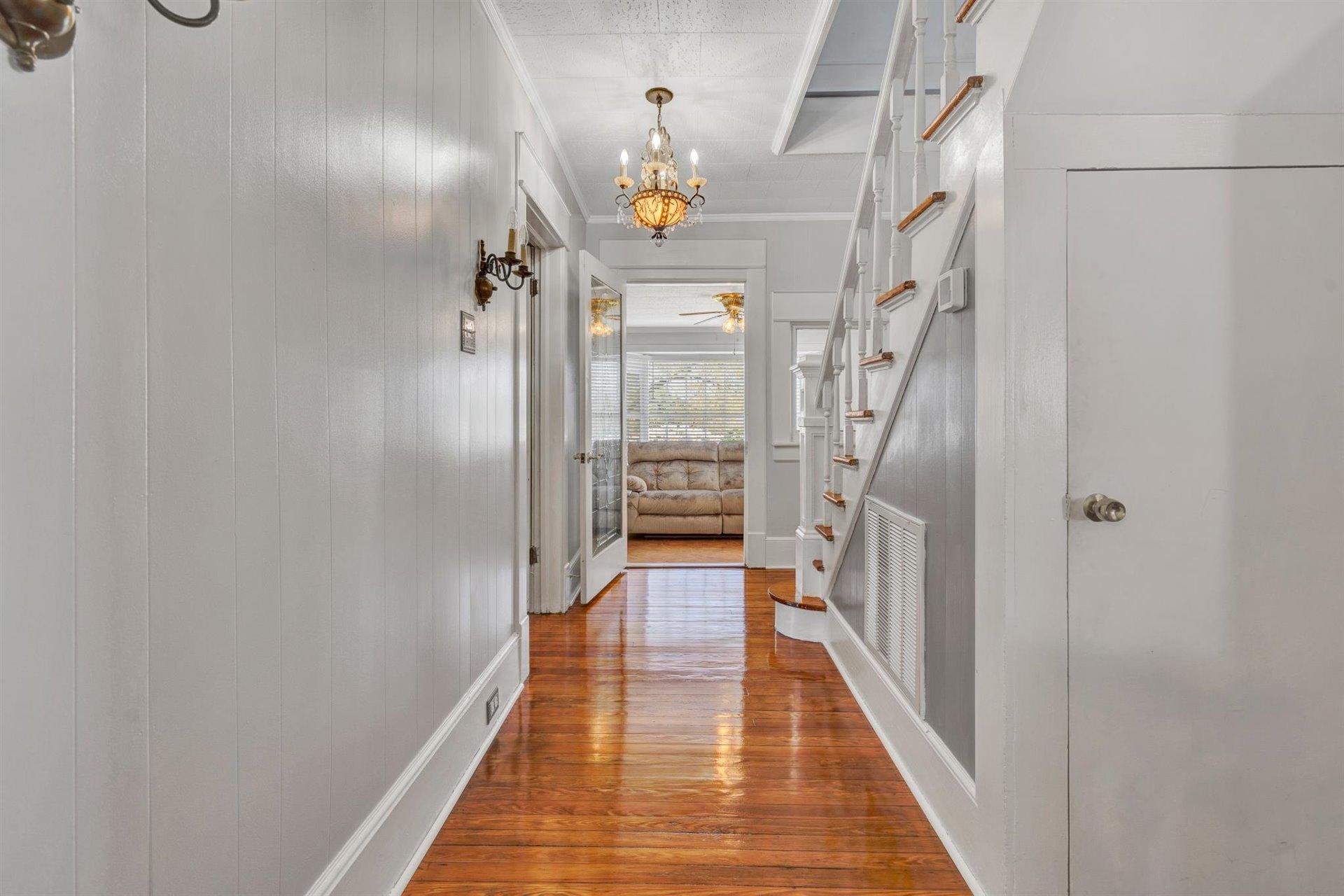 3840 Cove Road Roanoke, VA 24017 - Photo 18 of 47 a view of a hallway with wooden floor and staircase