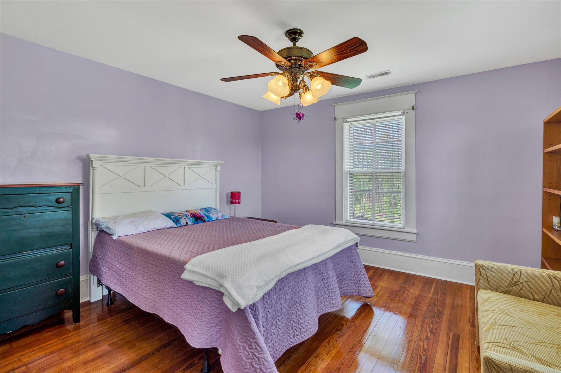 3840 Cove Road Roanoke, VA 24017 - Photo 23 of 47 a bedroom with a bed and a chandelier
