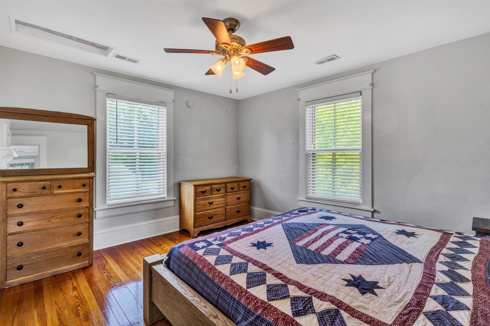 3840 Cove Road Roanoke, VA 24017 - Photo 24 of 47 a bedroom with a bed and wooden floor