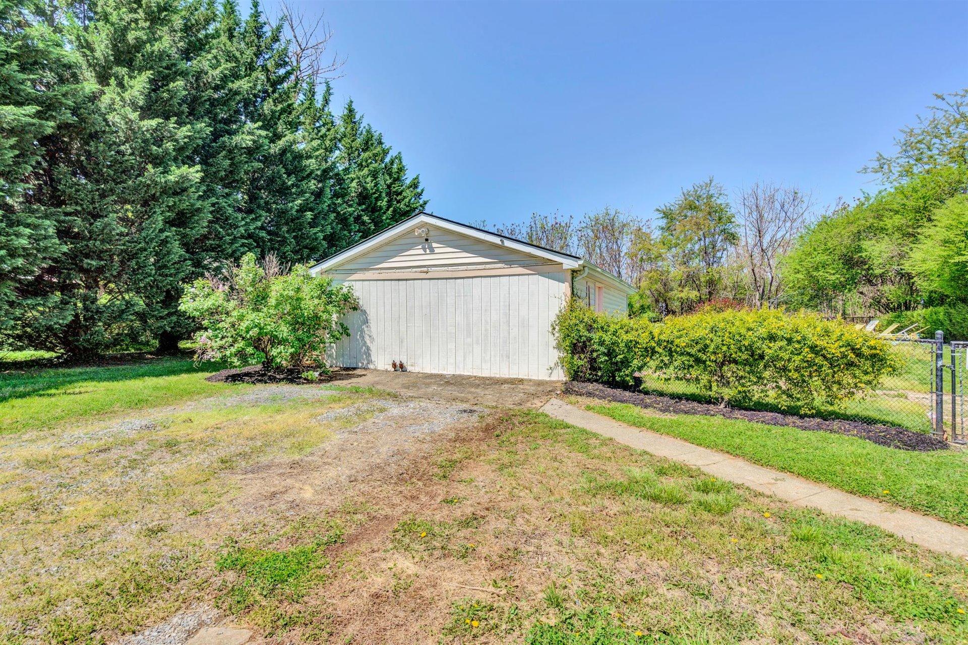 3840 Cove Road Roanoke, VA 24017 - Photo 43 of 47 a view of a house with a yard and garage