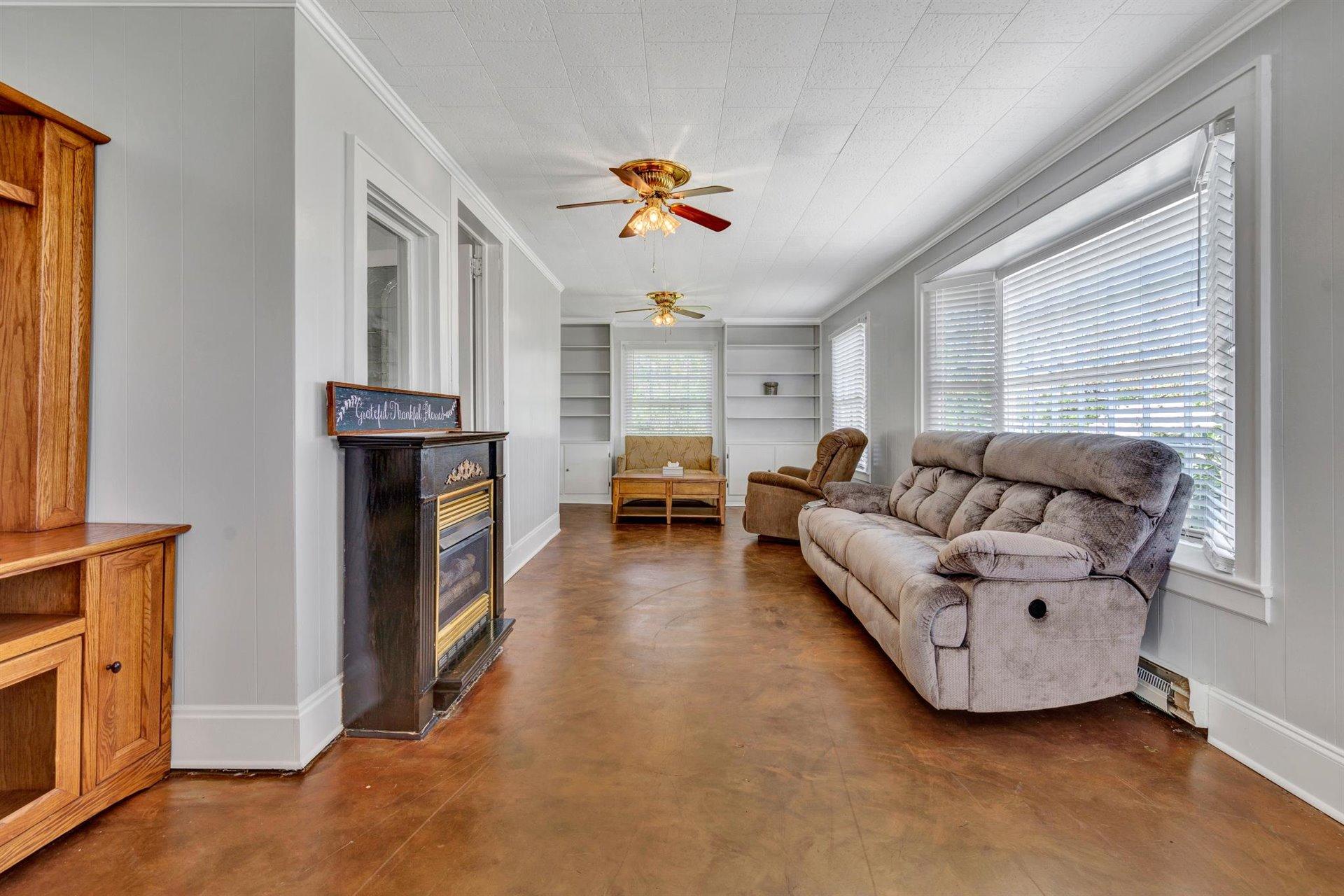 3840 Cove Road Roanoke, VA 24017 - Photo 7 of 47 a living room with furniture and a fireplace