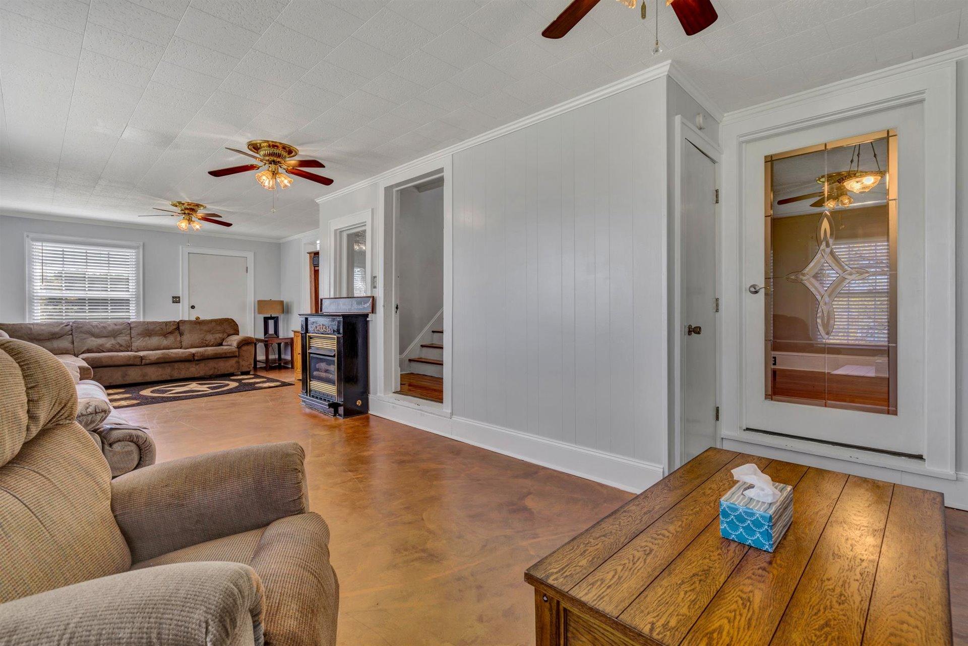 3840 Cove Road Roanoke, VA 24017 - Photo 9 of 47 a living room with furniture and a wooden floor