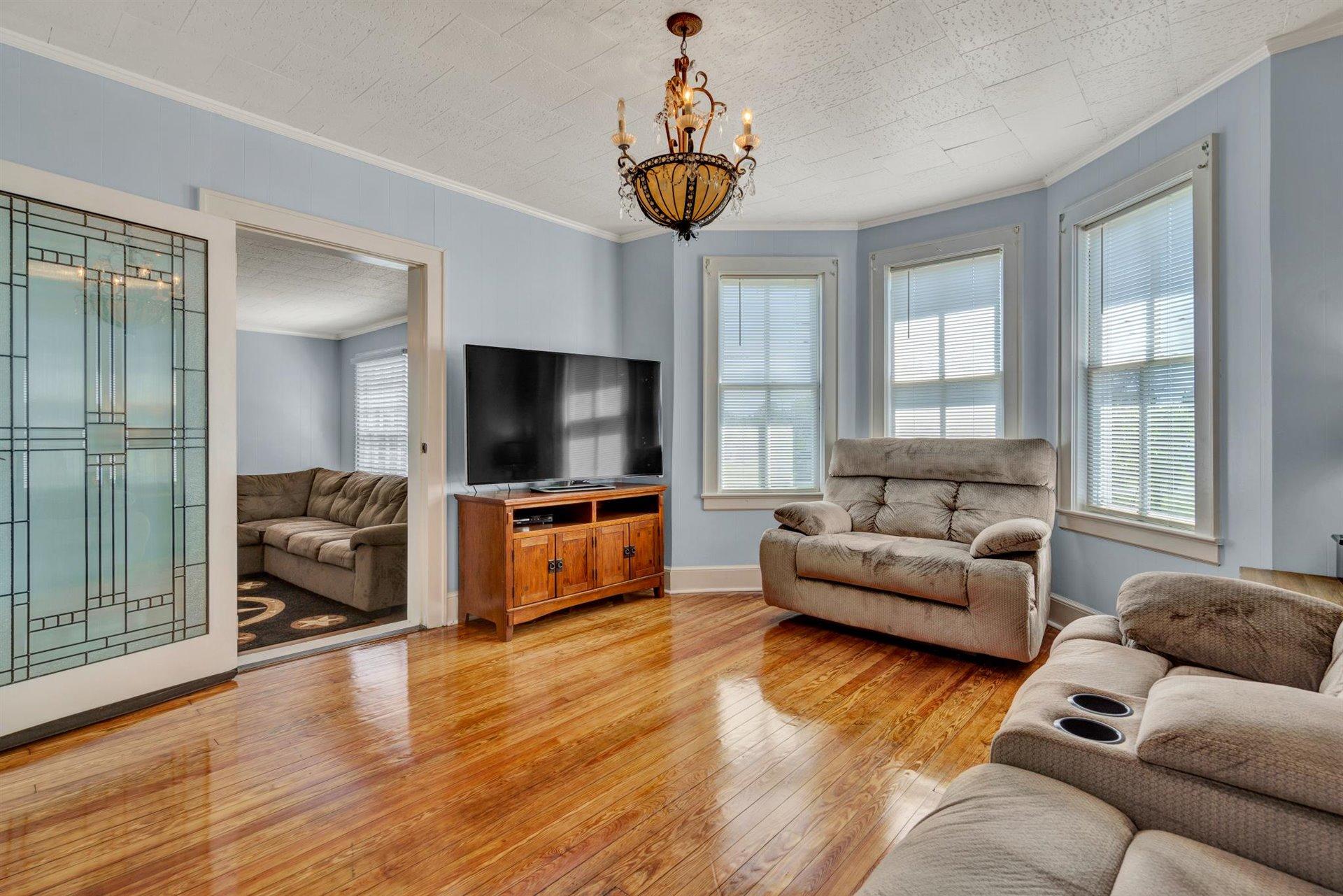 3840 Cove Road Roanoke, VA 24017 - Photo 10 of 47 a living room with furniture and a flat screen tv