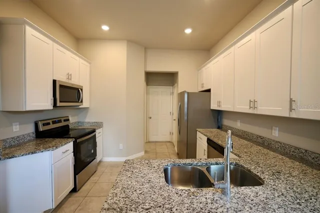 a bathroom with a toilet sink and a mirror