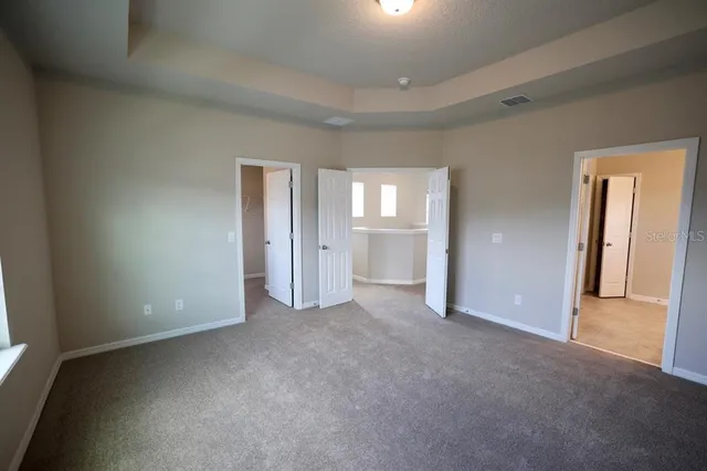 an aerial view of residential houses with outdoor space and swimming pool