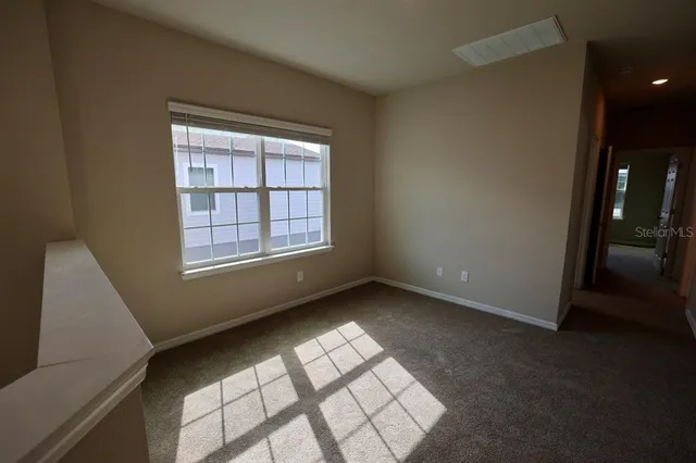 an aerial view of residential houses with outdoor space and river