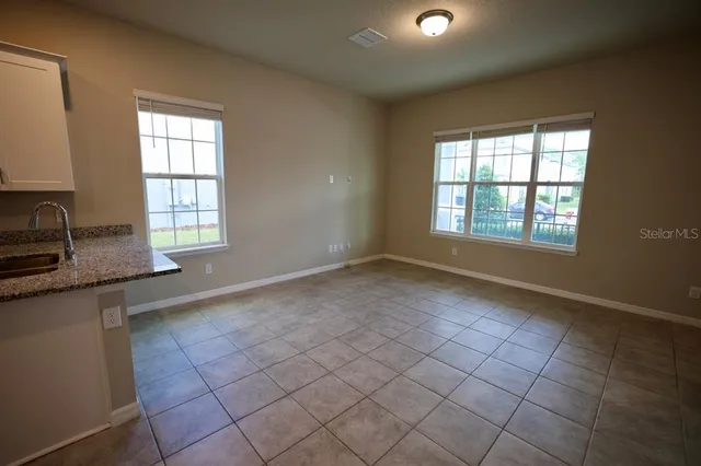 a view of a hallway with windows