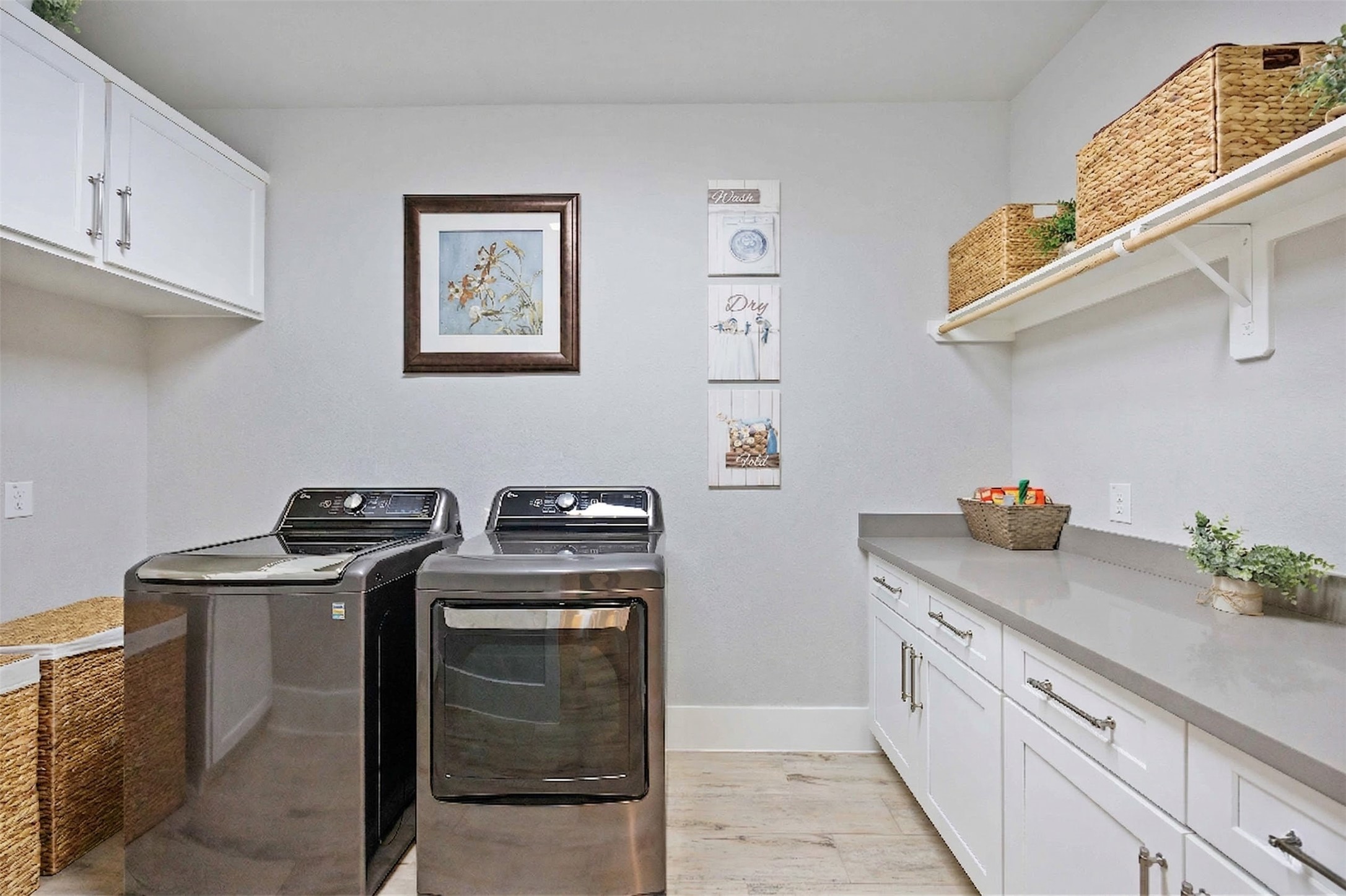 33510 Walnut Crossing Magnolia, TX 77355 - Photo 18 of 50 You'll appreciate this thoughtfully designed laundry room featuring upgraded cabinetry and generous storage, built for organization and efficiency.