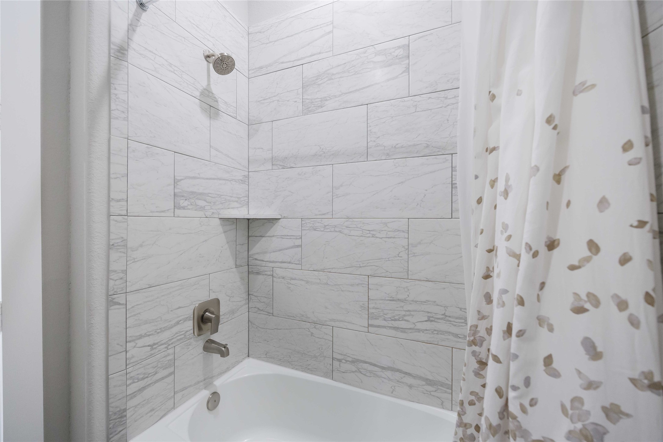 33510 Walnut Crossing Magnolia, TX 77355 - Photo 21 of 50 Relax in a secondary bathroom with a tub and shower combo, perfect for both quick routines and unwinding at the end of the day.