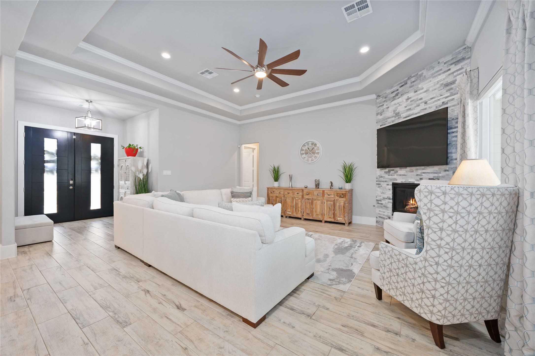 33510 Walnut Crossing Magnolia, TX 77355 - Photo 3 of 50 The bright and open living space is centered around a cozy fireplace, perfect for gathering and relaxing.