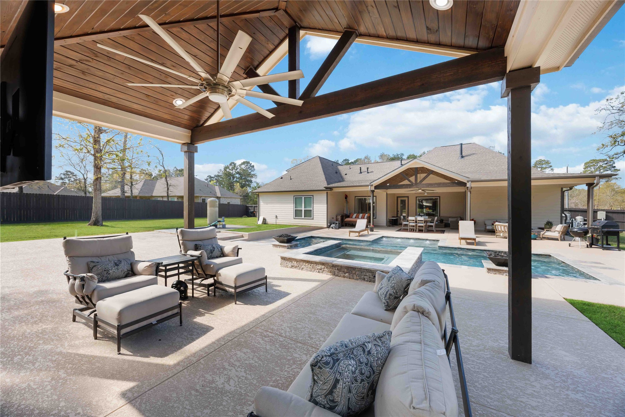 33510 Walnut Crossing Magnolia, TX 77355 - Photo 35 of 50 From above, the backyard comes to life with a private pool, spa, and outdoor spaces designed for gathering, relaxing, and enjoying every season.