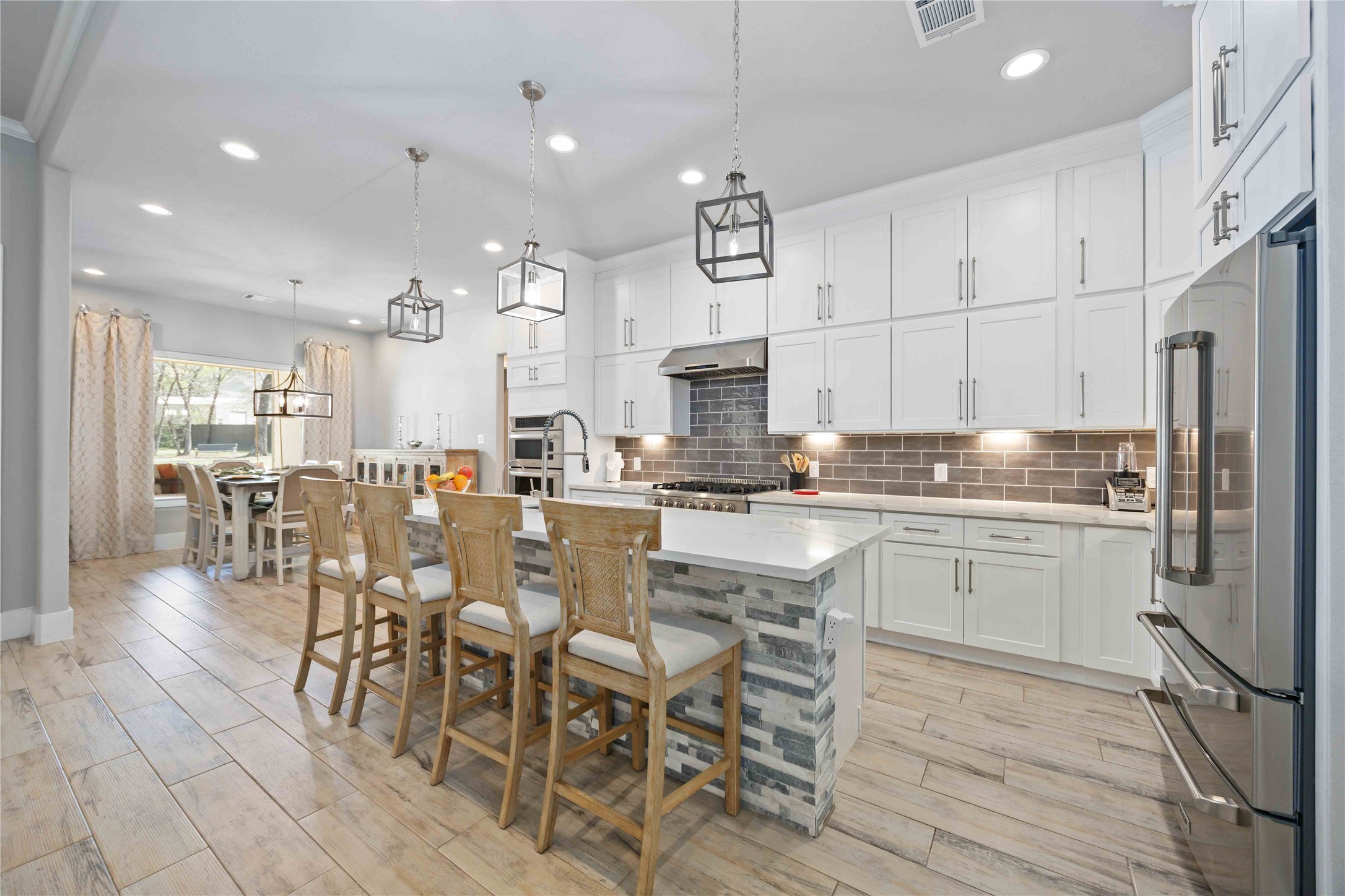 33510 Walnut Crossing Magnolia, TX 77355 - Photo 5 of 50 The kitchen features quartz countertops and an abundance of cabinets for storage.