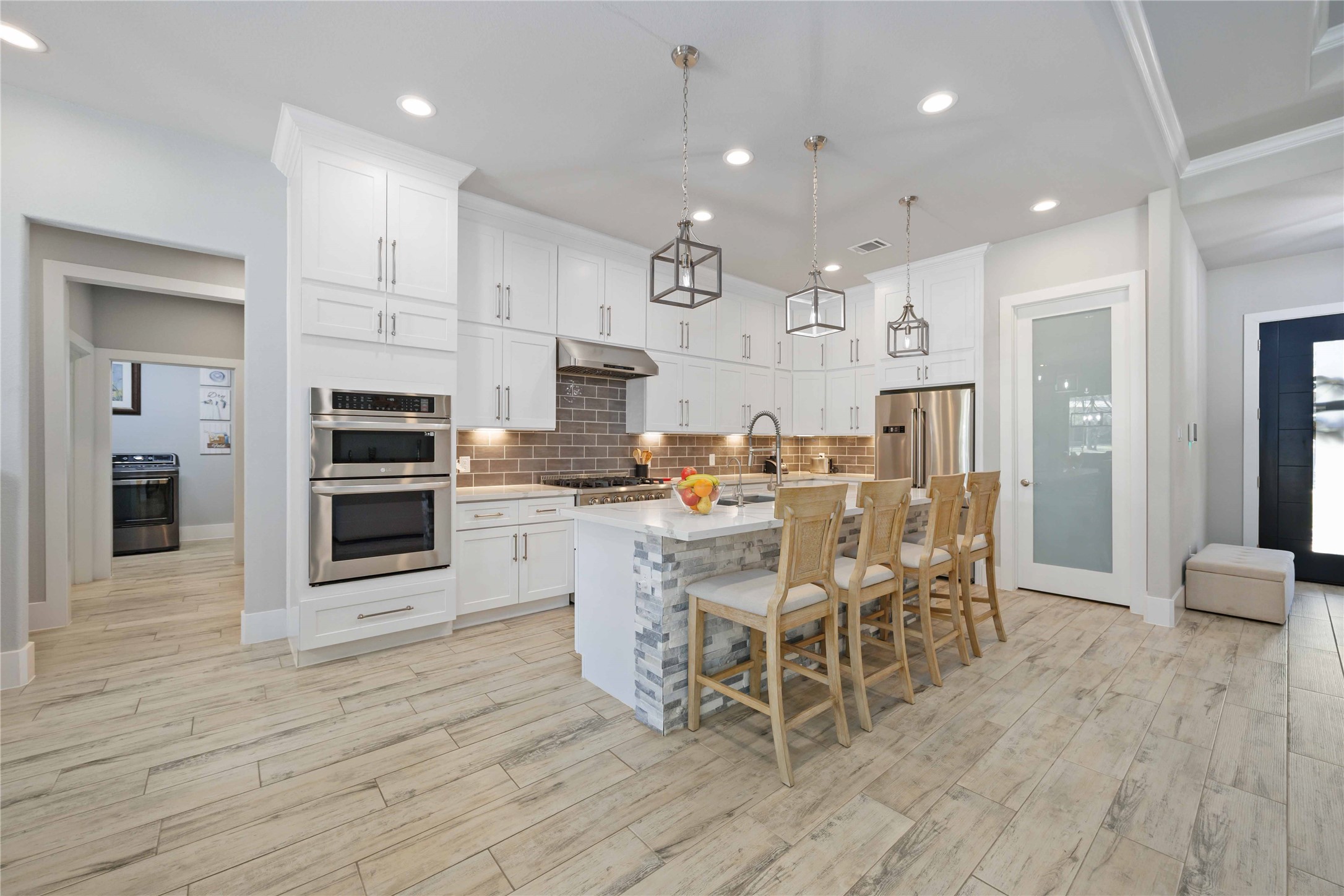 33510 Walnut Crossing Magnolia, TX 77355 - Photo 7 of 50 This kitchen is equipped with built-in stainless steel appliances and a gas cooktop, this kitchen blends modern functionality with clean, timeless design.