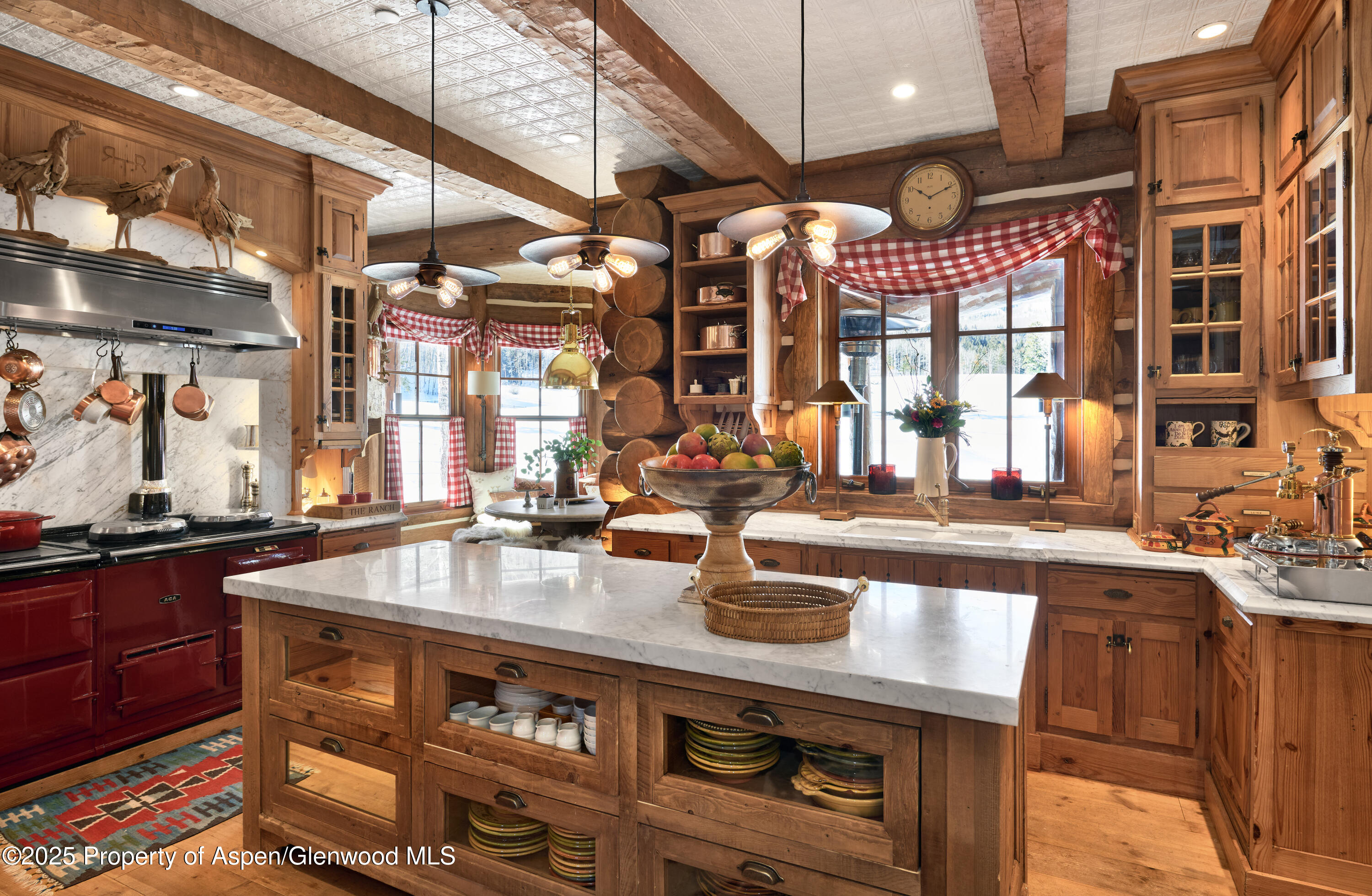6855 Capitol Creek Road Snowmass, CO 81654 - Photo 8 of 41 a kitchen with a sink stove and cabinets