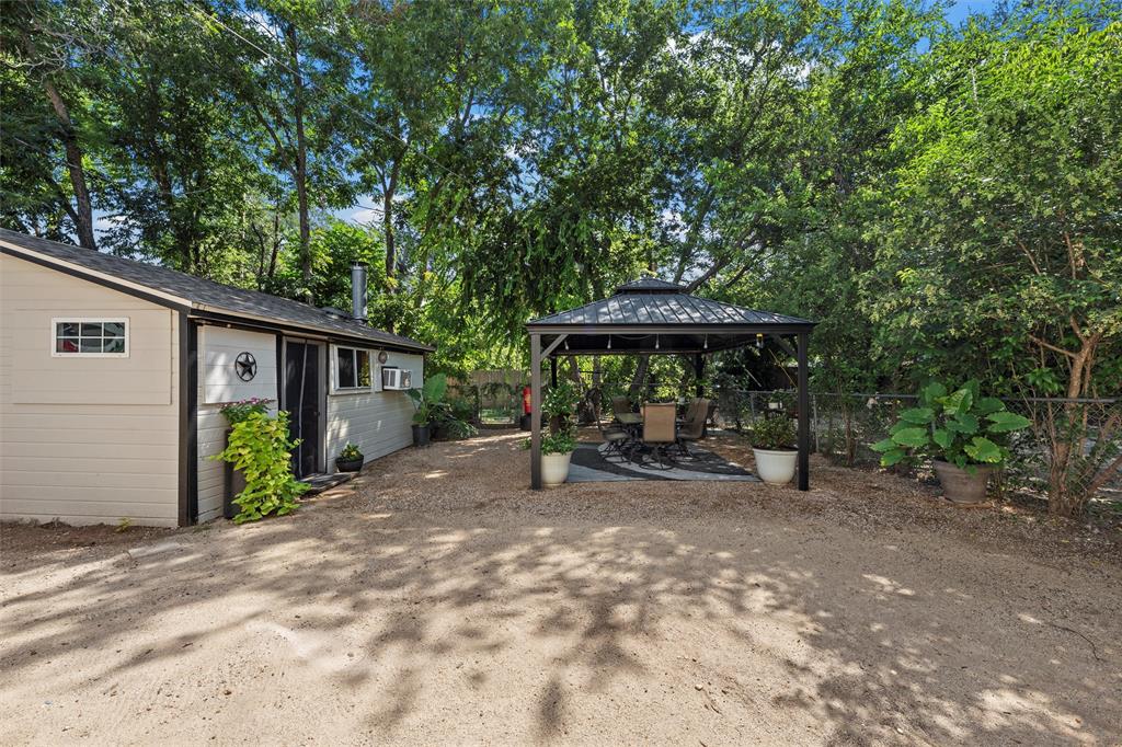 1205 North 17th Street Waco, TX 76707 - Photo 28 of 38 View of patio with a gazebo and view of wooded area