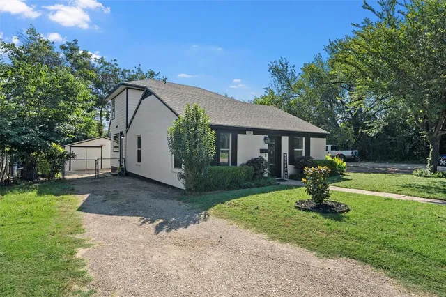 a house view with a garden space