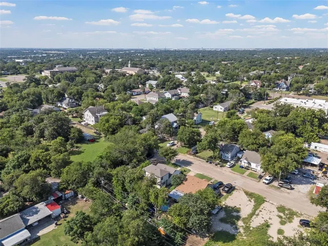 an aerial view of a city with lots of residential buildings
