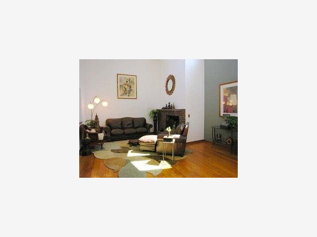 754 Excelso Court Fremont, CA 94539 - Photo 2 of 9 a living room with furniture and a dining table