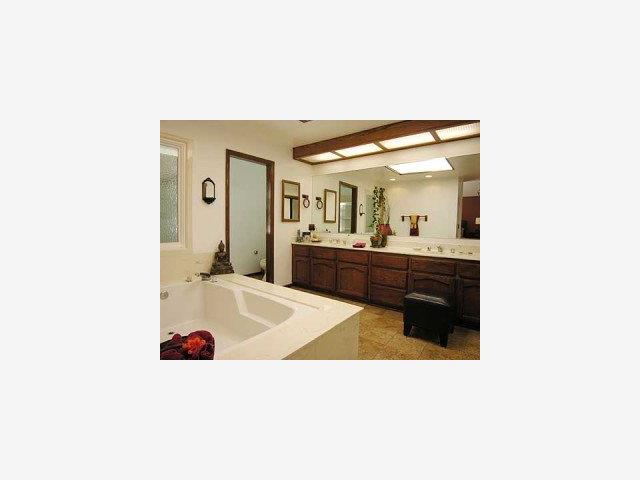 754 Excelso Court Fremont, CA 94539 - Photo 7 of 9 a bathroom with a sink and a mirror