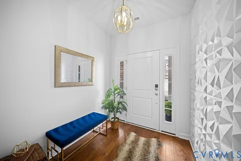 a view of an entryway with wooden floor