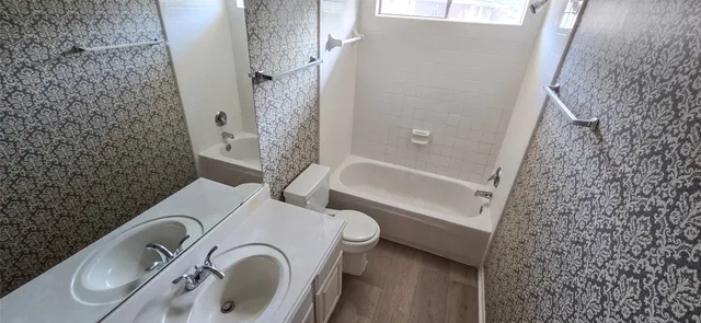 a bathroom with a sink and a shower