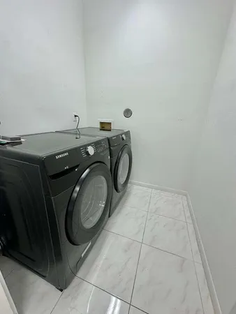 a view of a kitchen with a sink and an oven