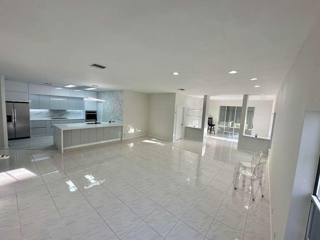 7660 Mansfield Hollow Road Delray Beach, FL 33446 - Photo 13 of 30 a view of a kitchen with a sink and an oven