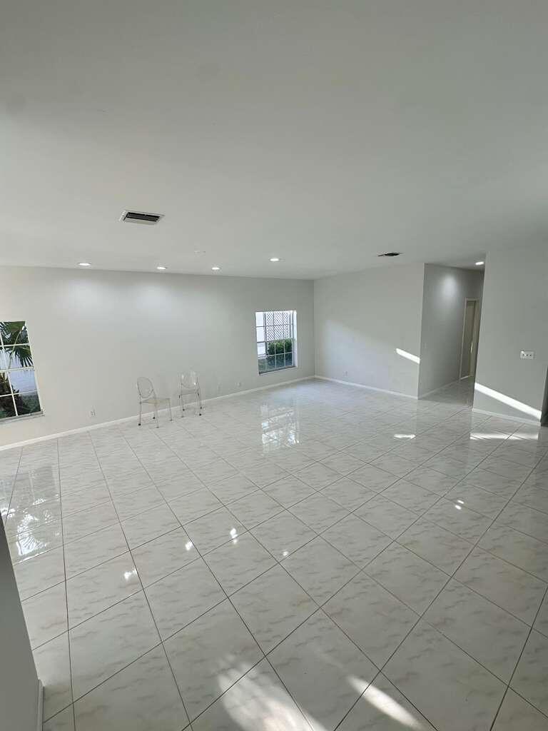 7660 Mansfield Hollow Road Delray Beach, FL 33446 - Photo 14 of 30 a view of a livingroom with an empty space and a window