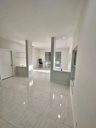 a bathroom with a double vanity sink mirror and toilet