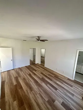 a view of walk in closet with empty racks