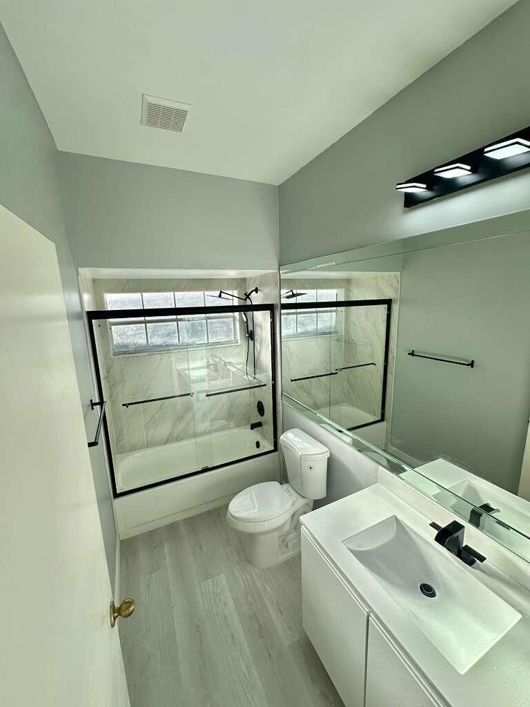 7660 Mansfield Hollow Road Delray Beach, FL 33446 - Photo 26 of 30 a bathroom with a sink and mirror