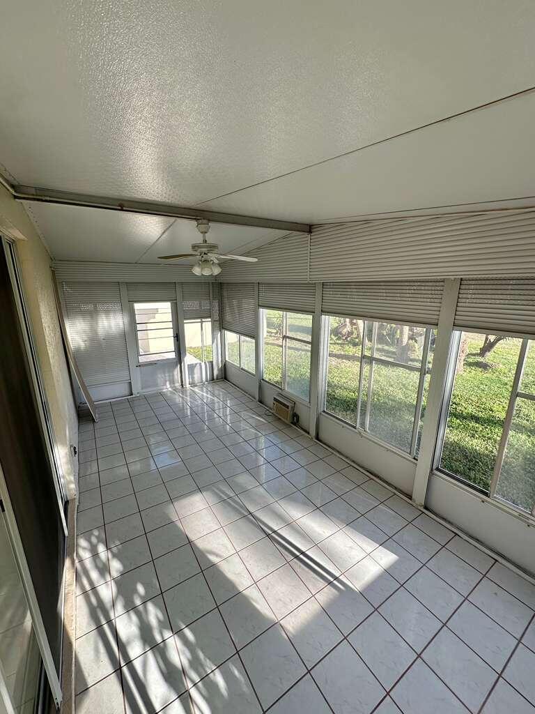 7660 Mansfield Hollow Road Delray Beach, FL 33446 - Photo 28 of 30 a view of empty room with wooden floor